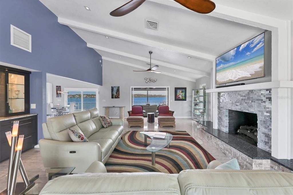 7985 Manasota Key Road Englewood, FL 34223 - Photo 5 of 83 a living room with furniture fireplace and window