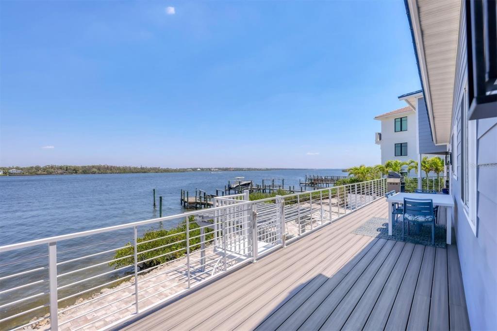 7985 Manasota Key Road Englewood, FL 34223 - Photo 56 of 83 a view of roof deck with two chairs and wooden floor