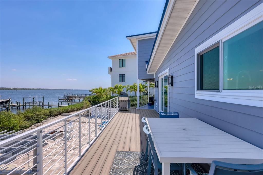 7985 Manasota Key Road Englewood, FL 34223 - Photo 57 of 83 a view of a house with backyard and balcony
