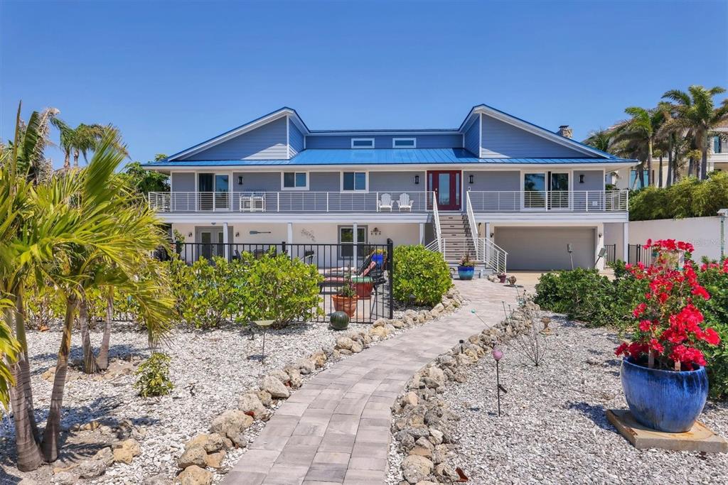 7985 Manasota Key Road Englewood, FL 34223 - Photo 81 of 83 a front view of a house with a yard