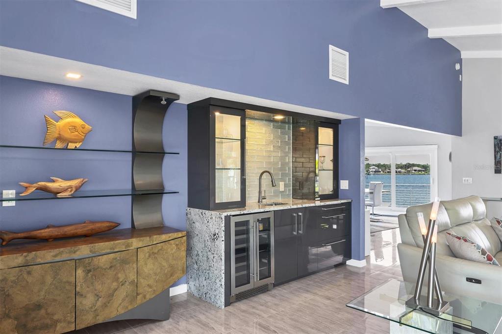 7985 Manasota Key Road Englewood, FL 34223 - Photo 10 of 83 a living room with furniture and wooden floor