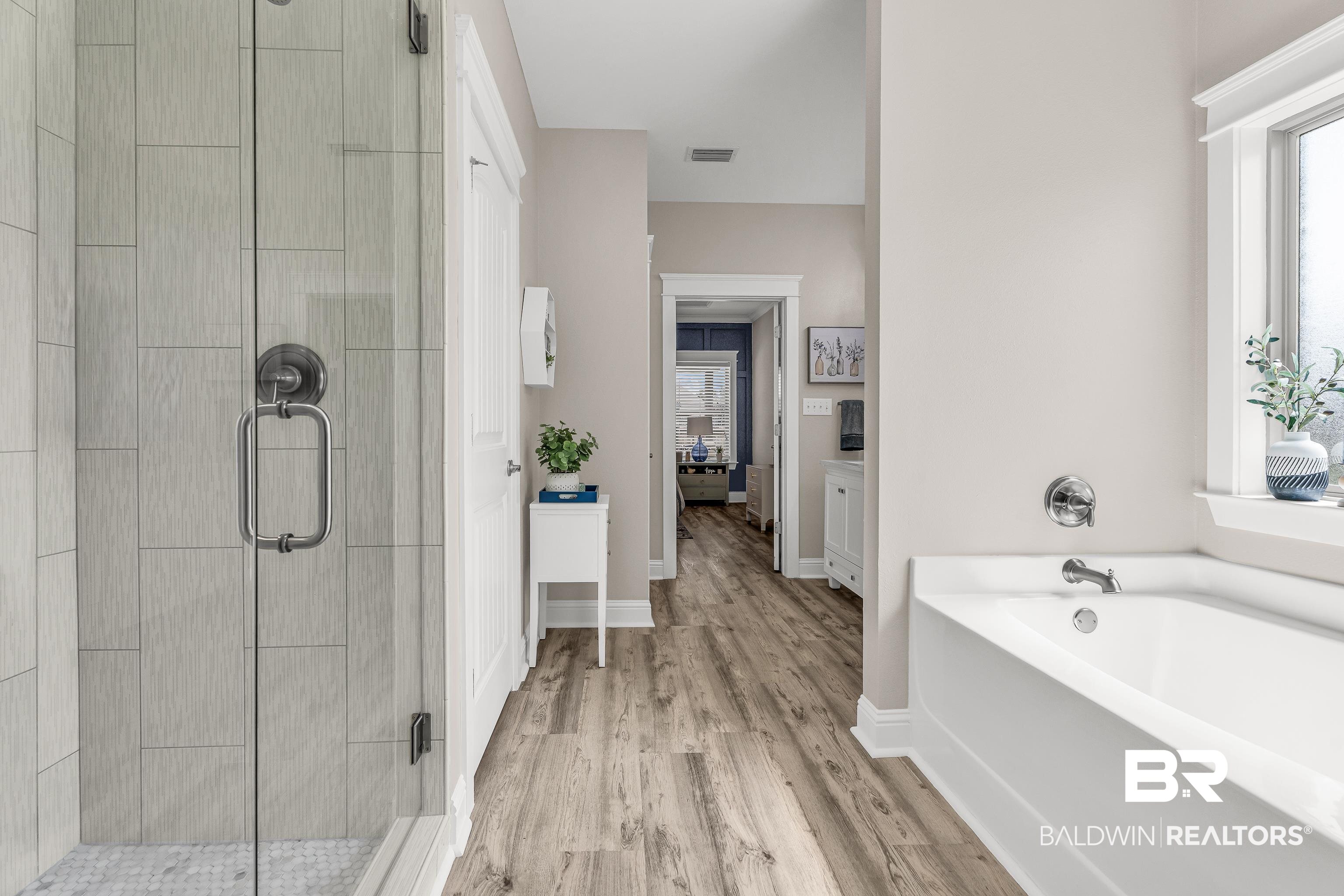 9675 Camberwell Drive Daphne, AL 36526 - Photo 22 of 34 Ensuite bathroom featuring a shower stall, a bath, and wood finished floors