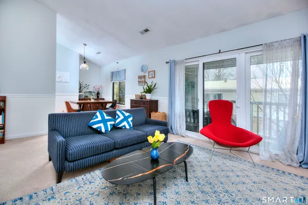 a living room with furniture and a table