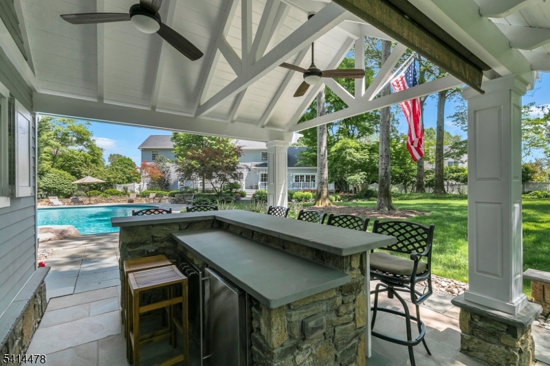33 St Nickolas Way Bernards, NJ 07920 - Photo 43 of 50 a view of backyard with swimming pool and outdoor seating