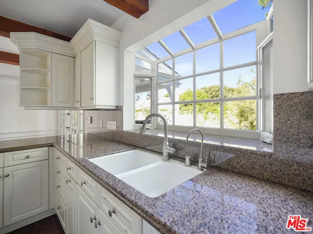 a kitchen with a sink and a window