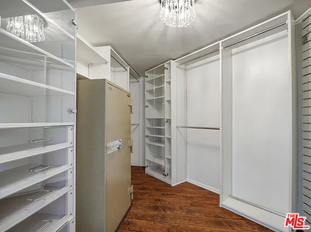 a bathroom with a tub a sink and a mirror