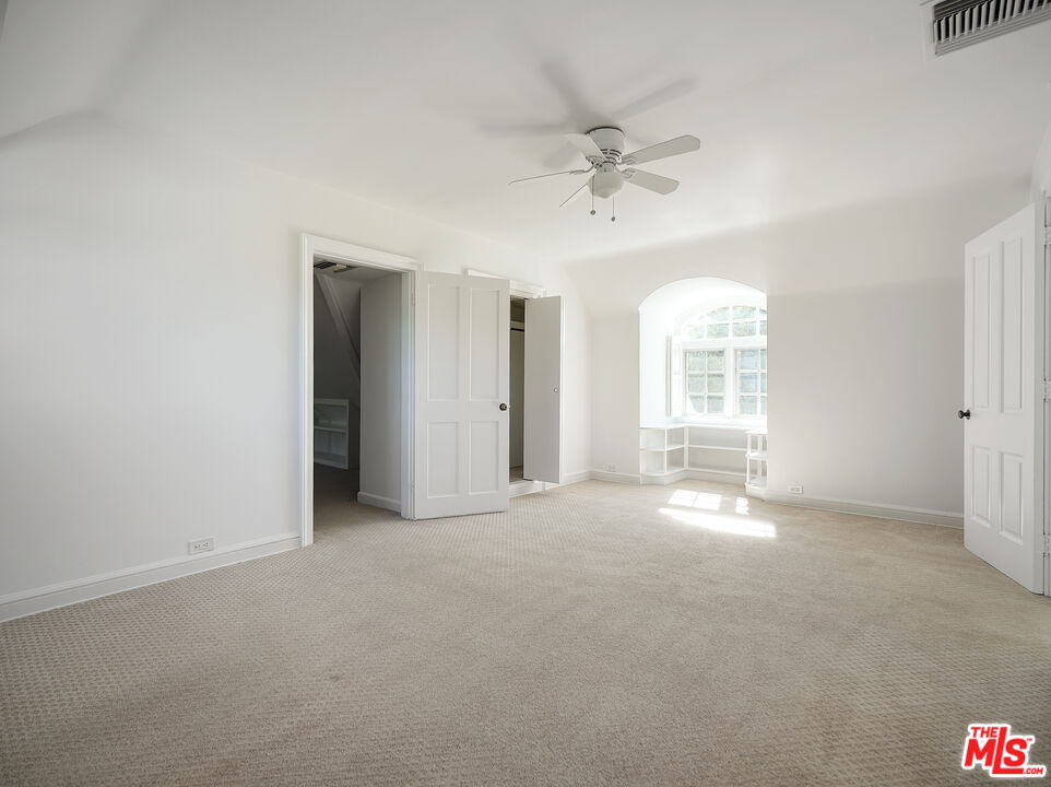 13161 Addison Street Sherman Oaks, CA 91423 - Photo 21 of 34 an empty room with windows and closet