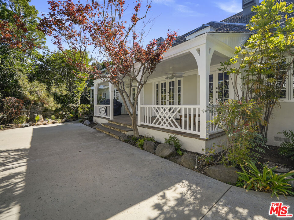 13161 Addison Street Sherman Oaks, CA 91423 - Photo 30 of 34 a front view of a house with garden