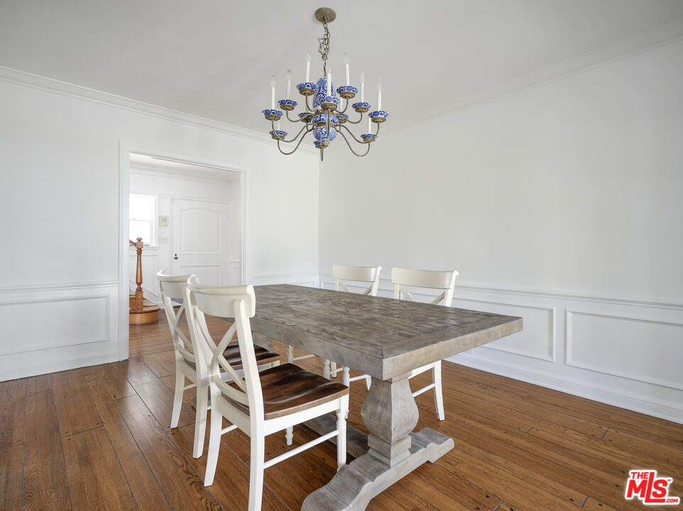 13161 Addison Street Sherman Oaks, CA 91423 - Photo 8 of 34 a view of a dining room with furniture and wooden floor