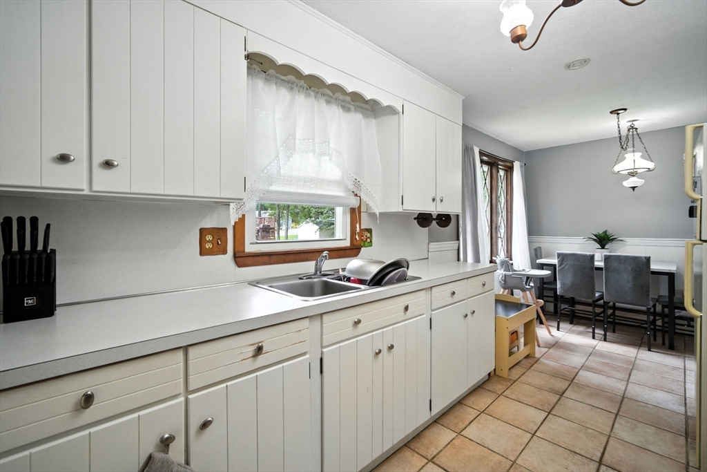 263 Cooley Street Springfield, MA 01128 - Photo 16 of 20 a kitchen with cabinets a sink and appliances
