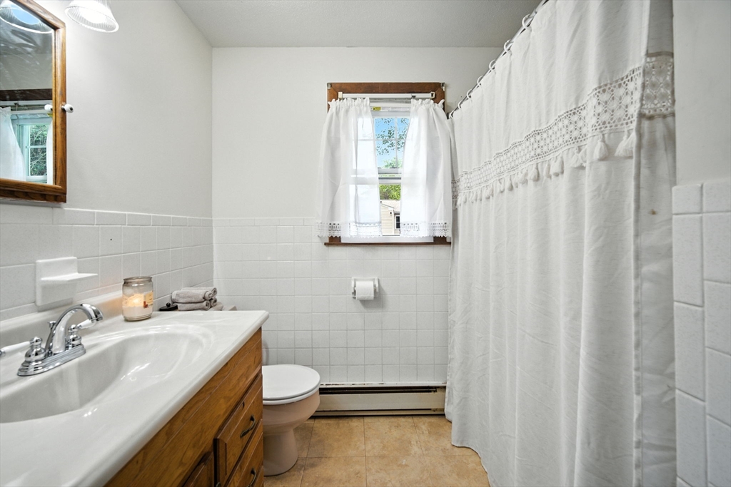 263 Cooley Street Springfield, MA 01128 - Photo 20 of 20 a bathroom with a sink toilet and shower
