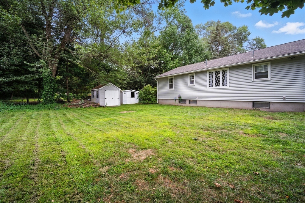 263 Cooley Street Springfield, MA 01128 - Photo 4 of 20 a front view of a house with a yard and garage