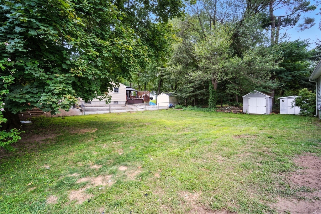 263 Cooley Street Springfield, MA 01128 - Photo 5 of 20 a view of a house with a yard porch and sitting area