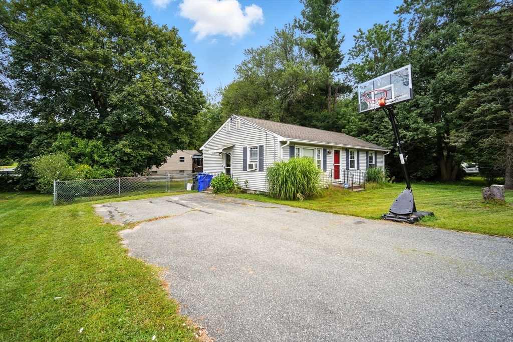 263 Cooley Street Springfield, MA 01128 - Photo 6 of 20 a view of house with outdoor space and garden
