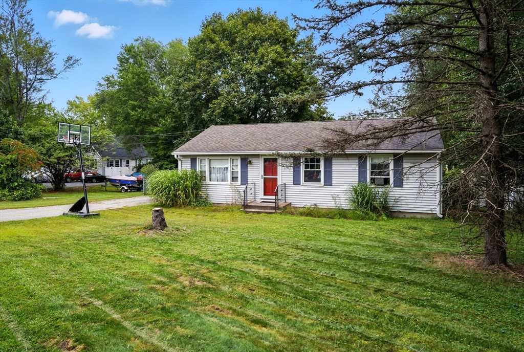 263 Cooley Street Springfield, MA 01128 - Photo 7 of 20 a front view of a house with a garden