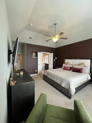 a view of a double vanity sink mirror and window