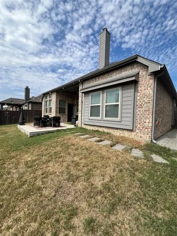 a view of swimming pool with outdoor seating space