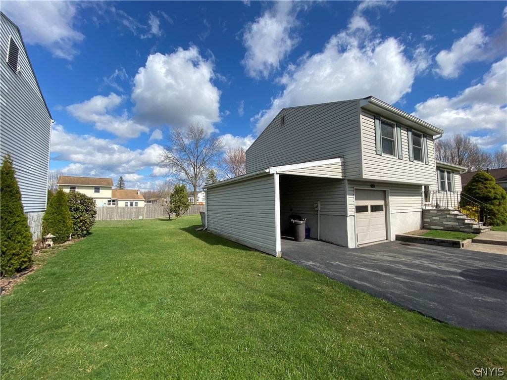 8003 Bamm Hollow Road Clay, NY 13041 - Photo 3 of 35 Side view of home. Enjoy an extra storage space p