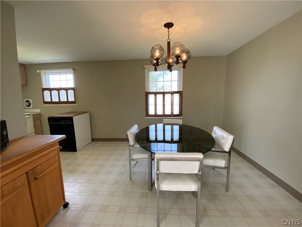 8003 Bamm Hollow Road Clay, NY 13041 - Photo 8 of 35 The living room leads right into the dining room.