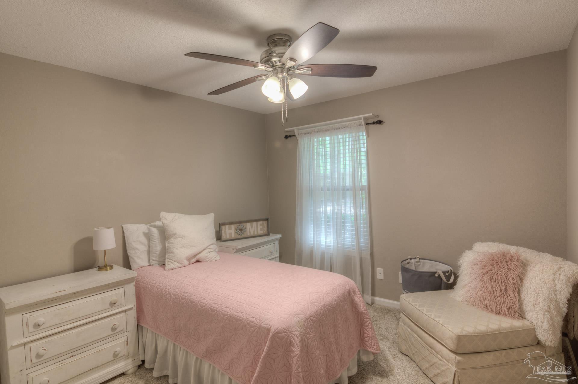 4917 Shell Road Milton, FL 32570 - Photo 20 of 49 a bedroom with a bed and window