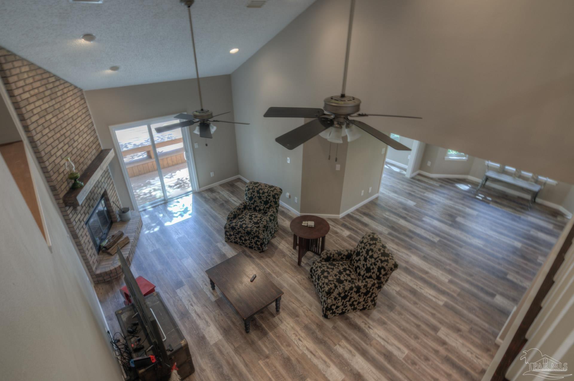 4917 Shell Road Milton, FL 32570 - Photo 23 of 49 a very nice looking room with a chair