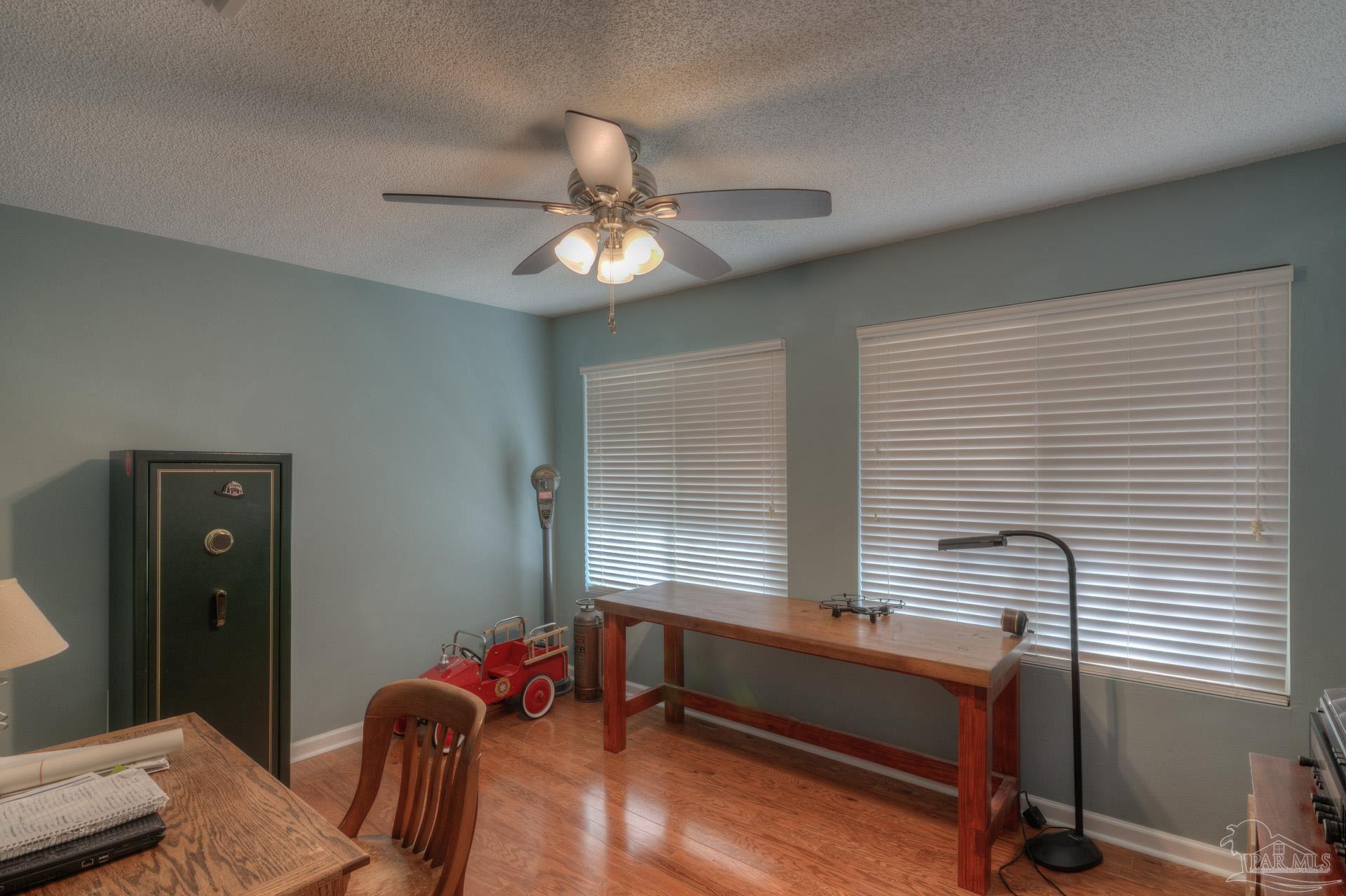 4917 Shell Road Milton, FL 32570 - Photo 27 of 49 a bedroom with furniture and a window