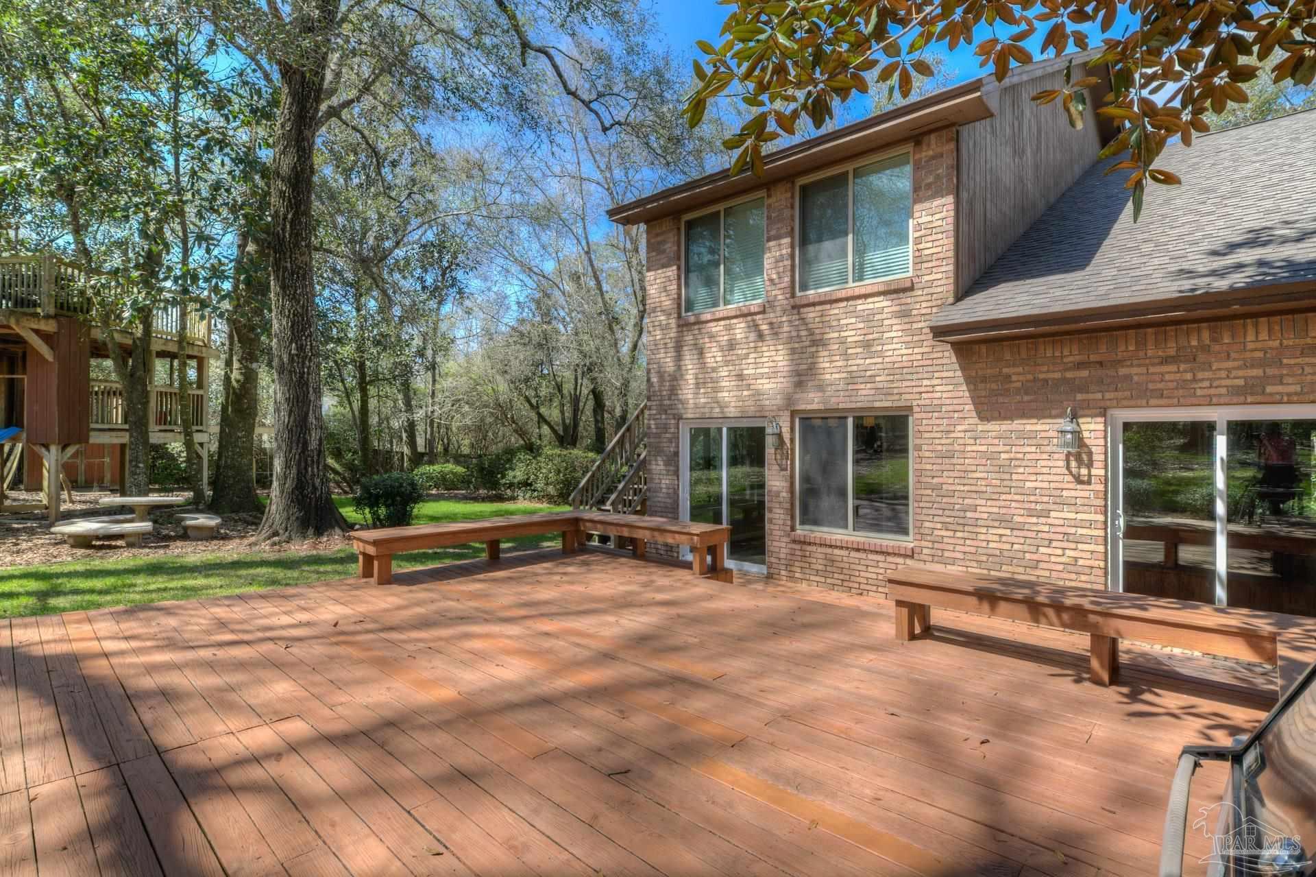 4917 Shell Road Milton, FL 32570 - Photo 36 of 49 a view of a house with backyard and sitting area