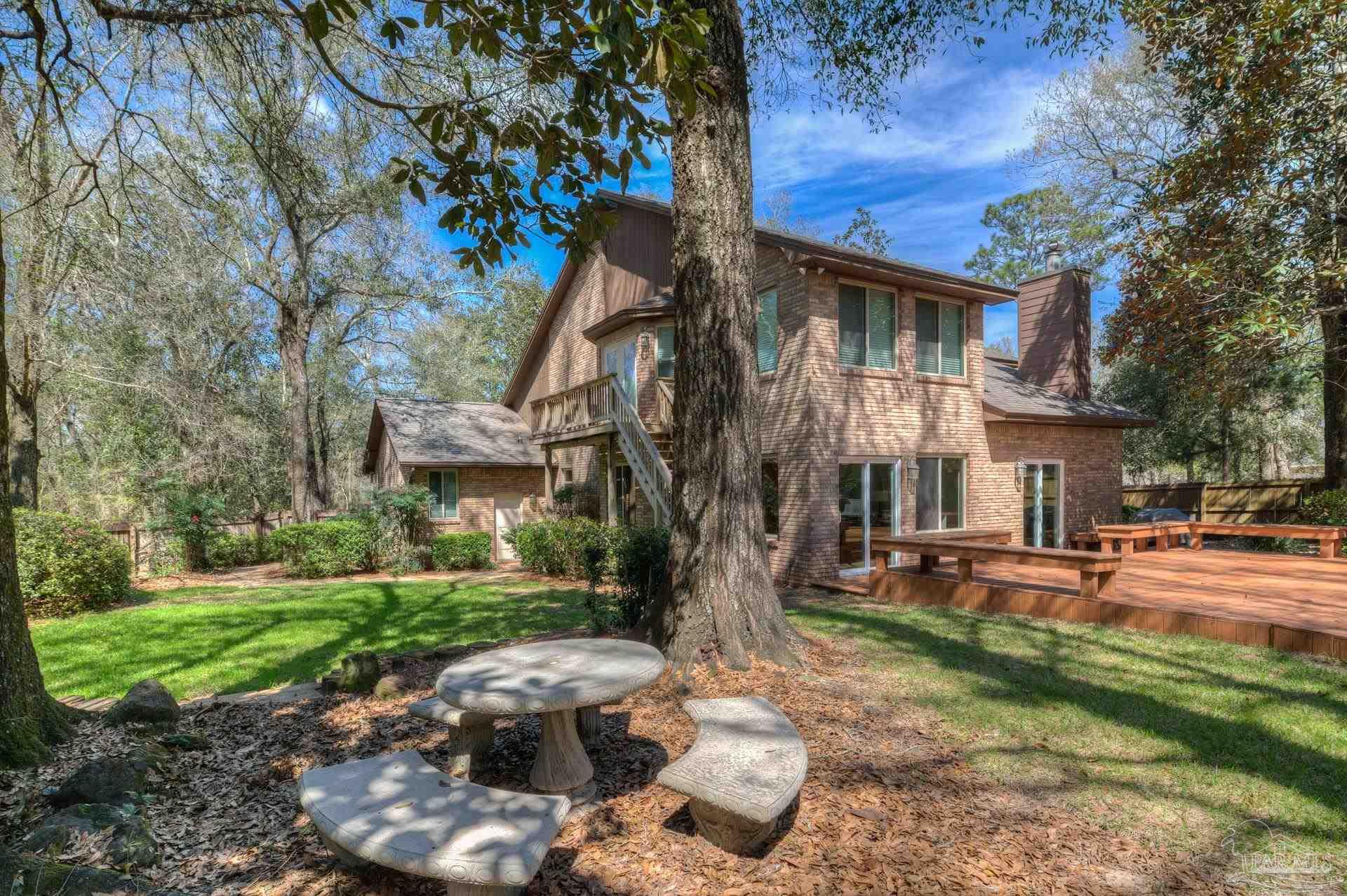 4917 Shell Road Milton, FL 32570 - Photo 41 of 49 a front view of a house with a yard