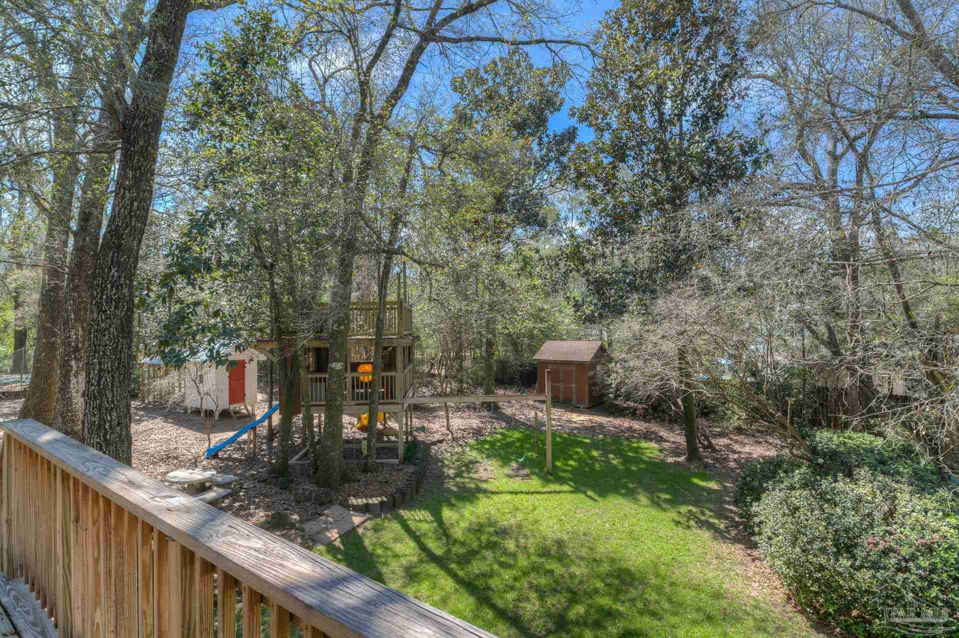 4917 Shell Road Milton, FL 32570 - Photo 42 of 49 a view of a patio with chair and table