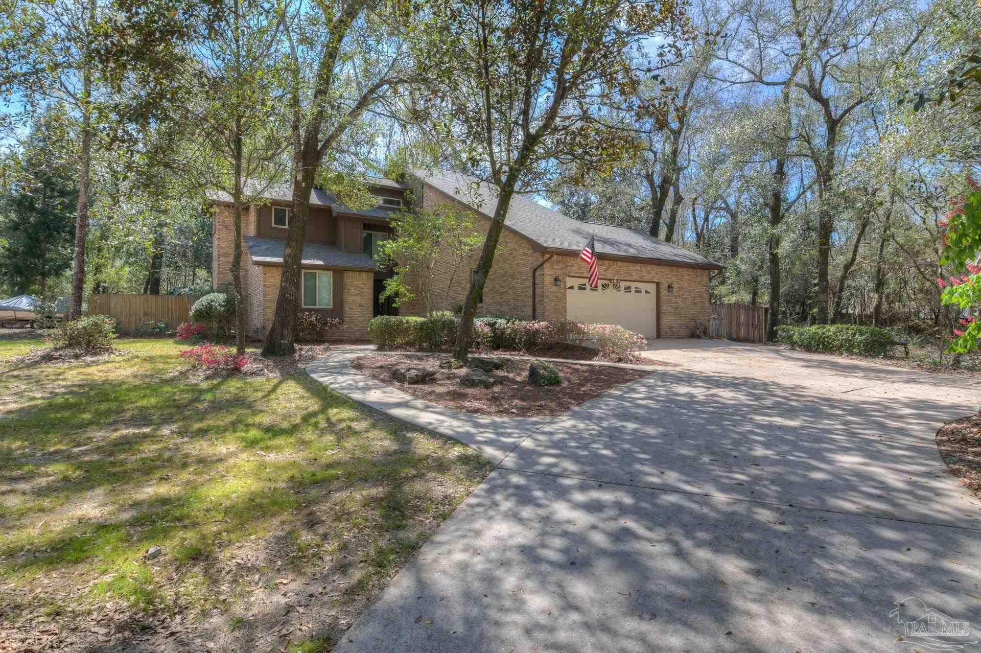 4917 Shell Road Milton, FL 32570 - Photo 47 of 49 a view of a house with a yard