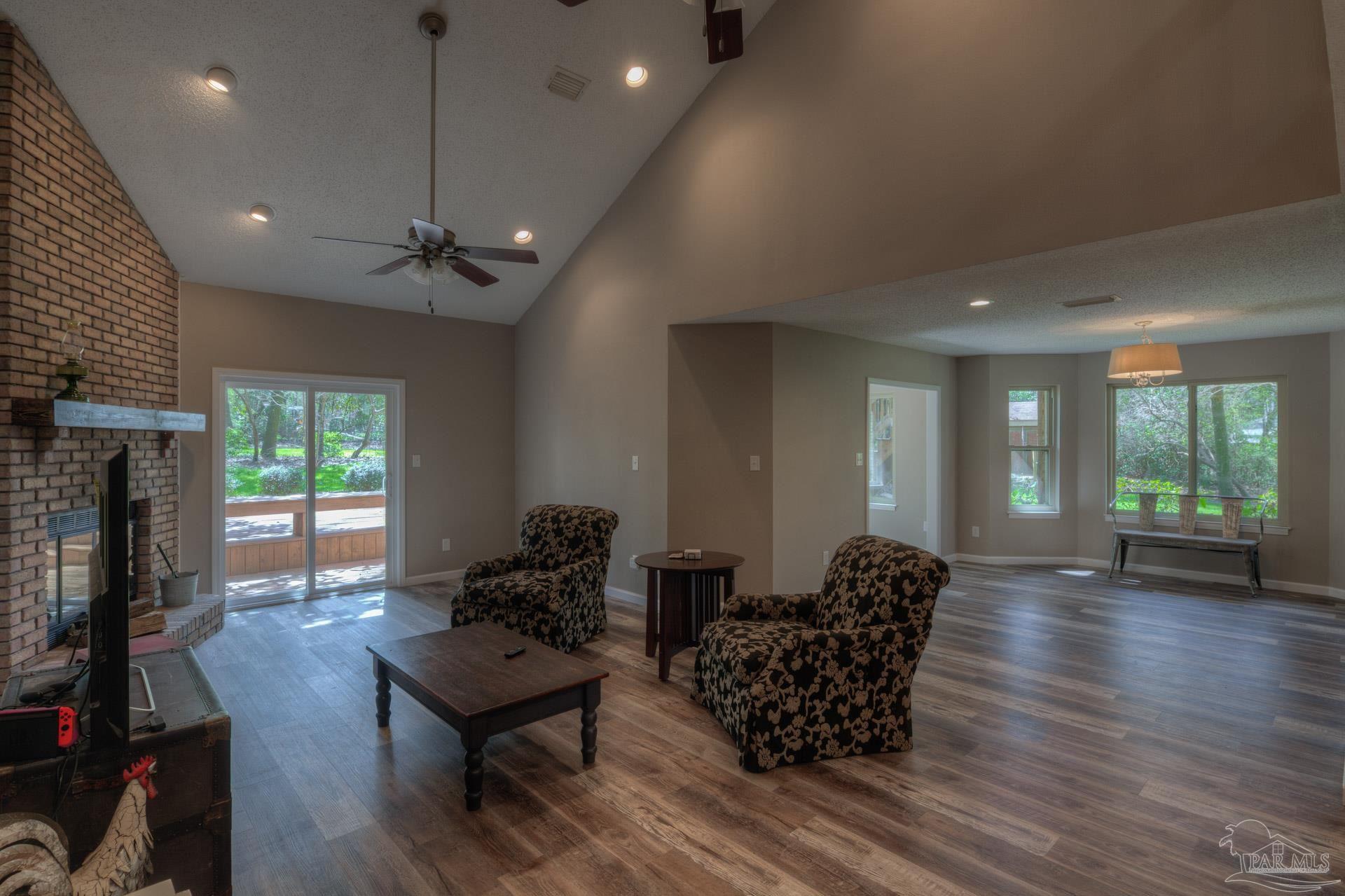 4917 Shell Road Milton, FL 32570 - Photo 9 of 49 a living room with furniture window and wooden floor