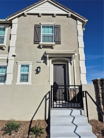 a front view of a house with stairs