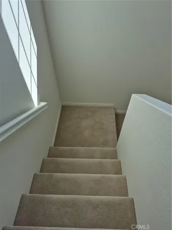 a view of staircase with empty racks