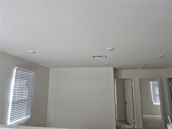 a view of hallway with windows