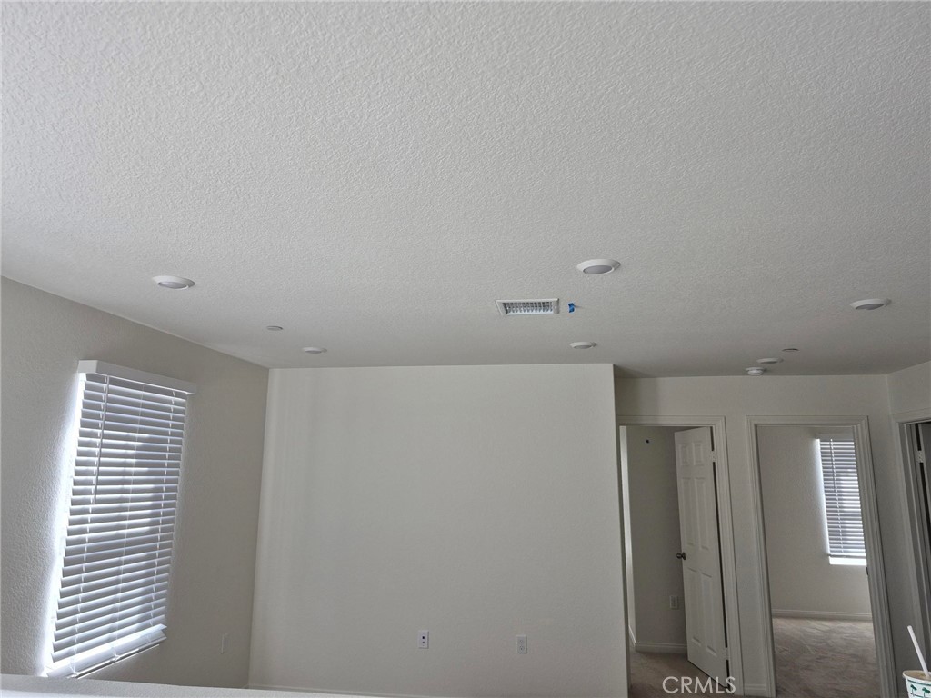 4233 East Rincon Street Ontario, CA 91761 - Photo 6 of 20 a view of hallway with windows