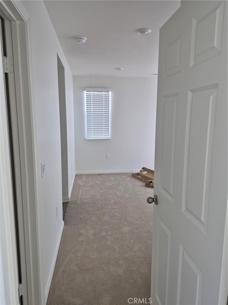 4233 East Rincon Street Ontario, CA 91761 - Photo 7 of 20 a view of a livingroom with a hardwood