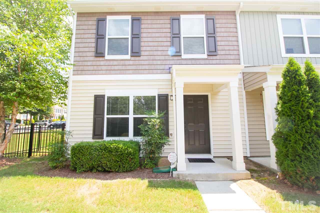 2901 Berkeley Springs Place Raleigh, NC 27616 - Photo 1 of 24 a view of a brick house with a yard plants and large tree