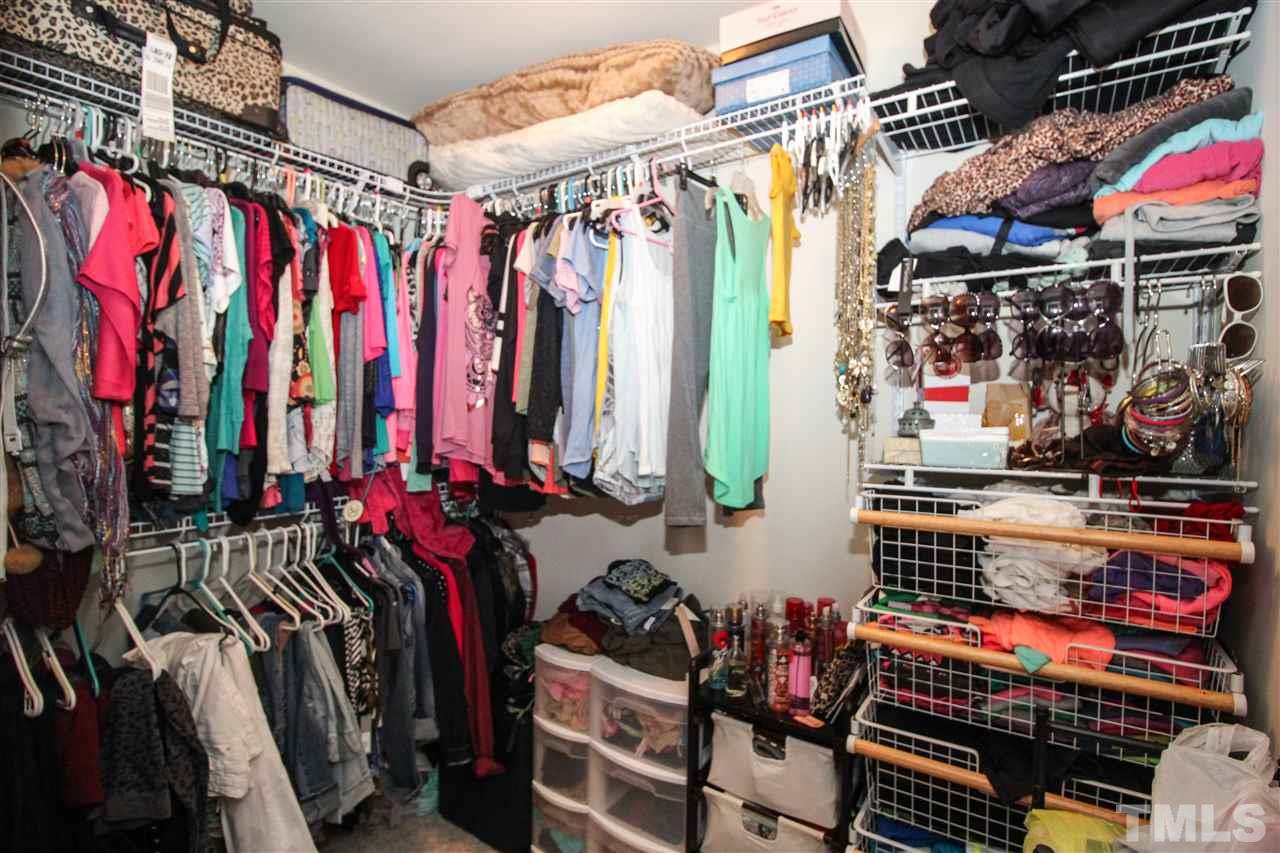 2901 Berkeley Springs Place Raleigh, NC 27616 - Photo 12 of 24 a view of walk in closet with clothes and shoes