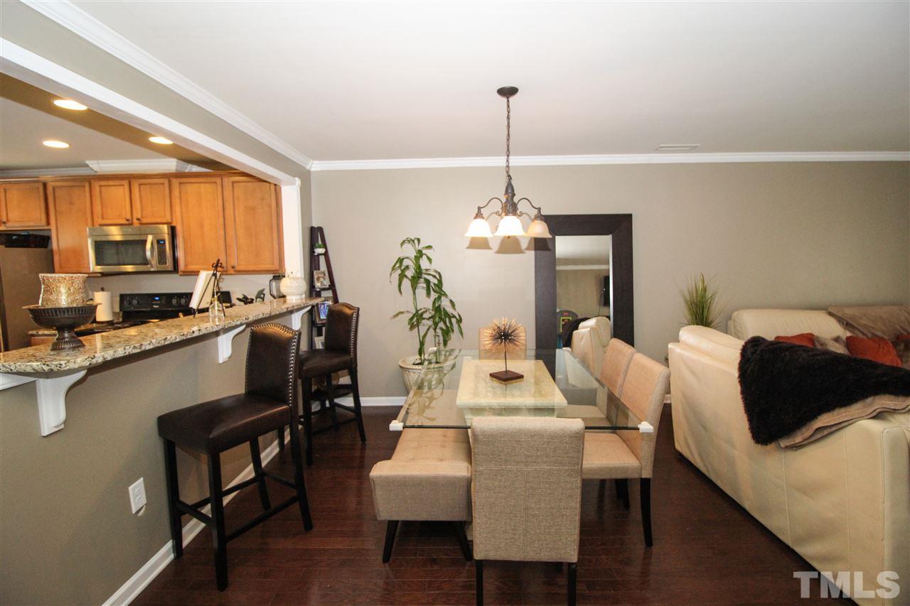 2901 Berkeley Springs Place Raleigh, NC 27616 - Photo 6 of 24 a view of a dining room with furniture window and wooden floor