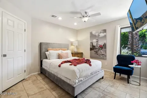 a bedroom with a bed and window