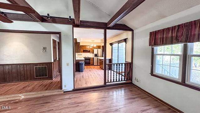 104 Baldwin Circle Garner, NC 27529 - Photo 11 of 20 an empty room with wooden floor and windows