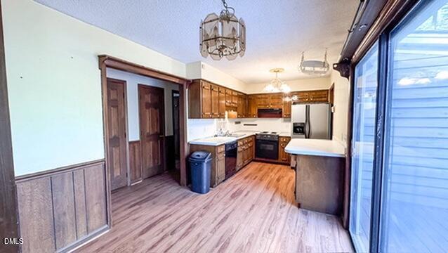104 Baldwin Circle Garner, NC 27529 - Photo 12 of 20 a large kitchen with a wooden floor and stainless steel appliances