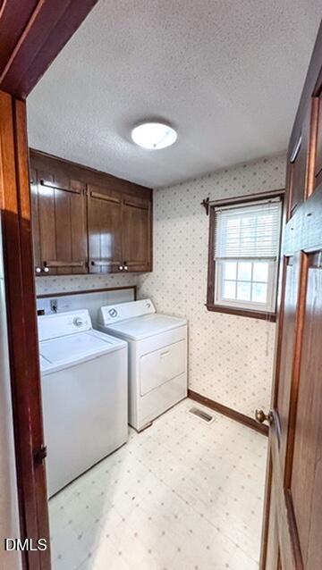 104 Baldwin Circle Garner, NC 27529 - Photo 13 of 20 a room with a stove a washer and dryer