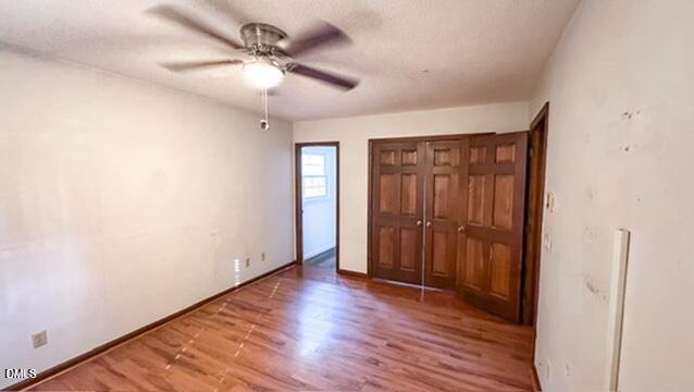104 Baldwin Circle Garner, NC 27529 - Photo 19 of 20 wooden floor in an empty room with a window