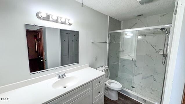 104 Baldwin Circle Garner, NC 27529 - Photo 20 of 20 a bathroom with a sink a toilet a shower and a mirror