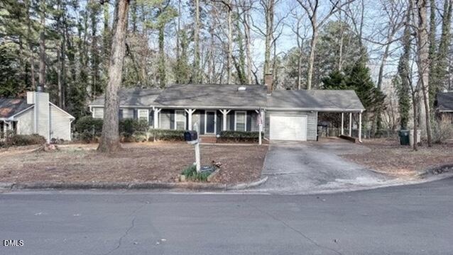 104 Baldwin Circle Garner, NC 27529 - Photo 2 of 20 a front view of a house with a tree