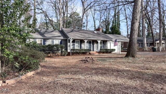 104 Baldwin Circle Garner, NC 27529 - Photo 3 of 20 a front view of a house with a garden