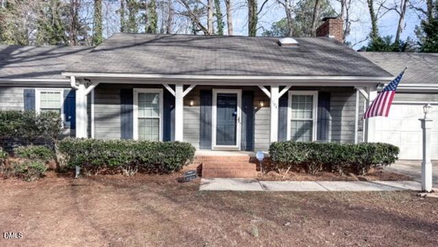 104 Baldwin Circle Garner, NC 27529 - Photo 4 of 20 a front view of a house with garden