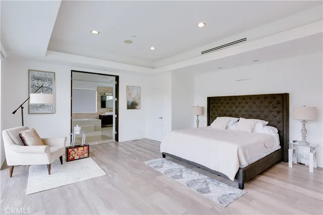 a bedroom with a bed and a couch