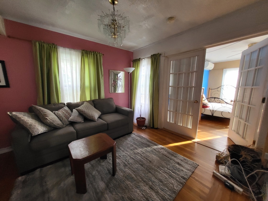 315 Main Street Everett, MA 02149 - Photo 12 of 37 a living room with furniture and a window